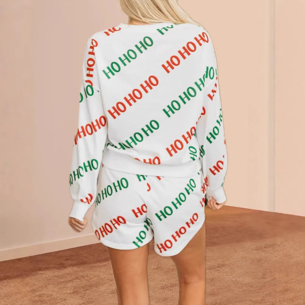 White women's two-piece suit with long sleeves and printed trousers featuring letter pattern