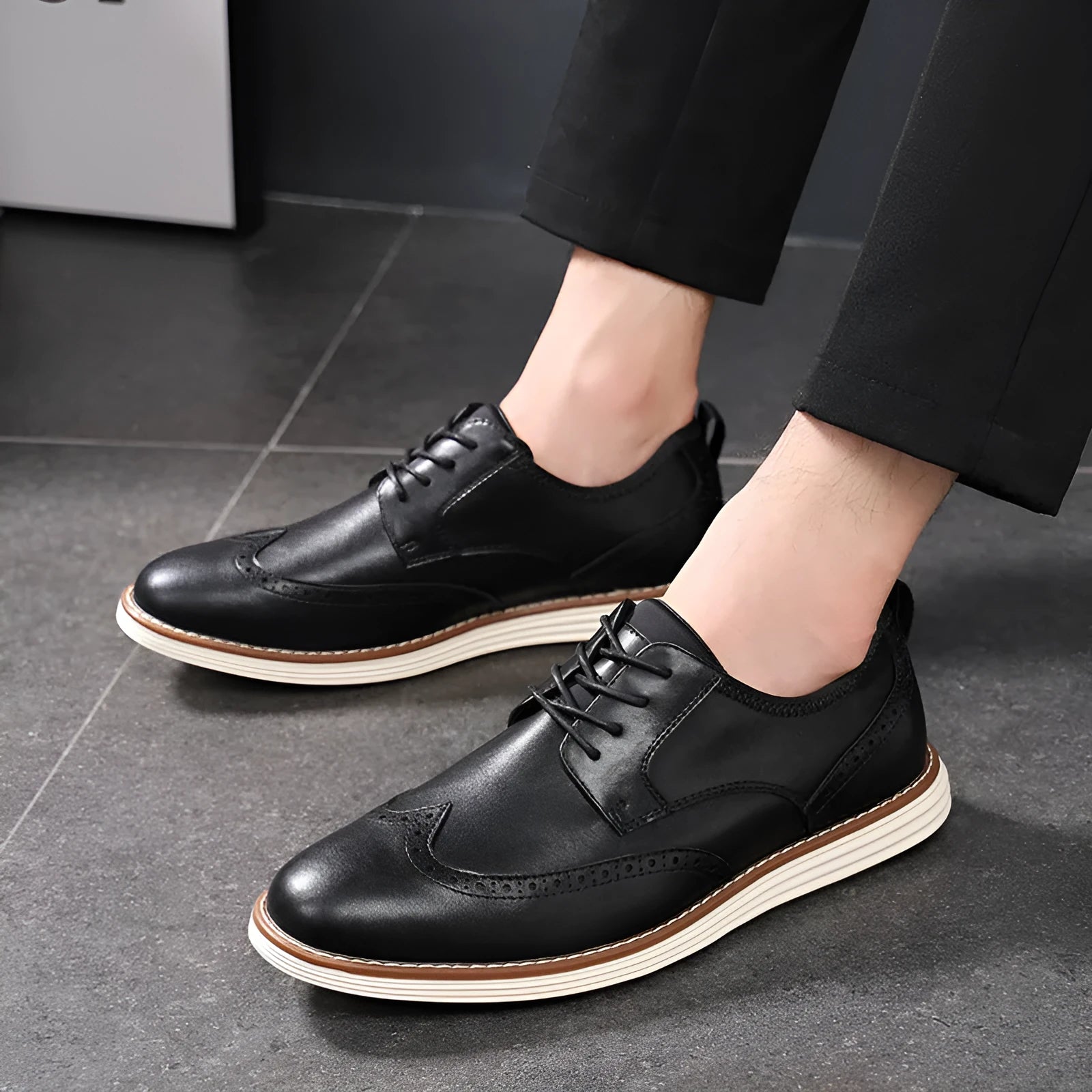 Men's black and brown slip-on business casual shoes with PU upper and carved detailing