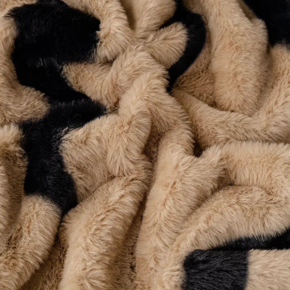 Zebra pattern flannel sofa slipcover in caramel colour, shown on a grey sofa