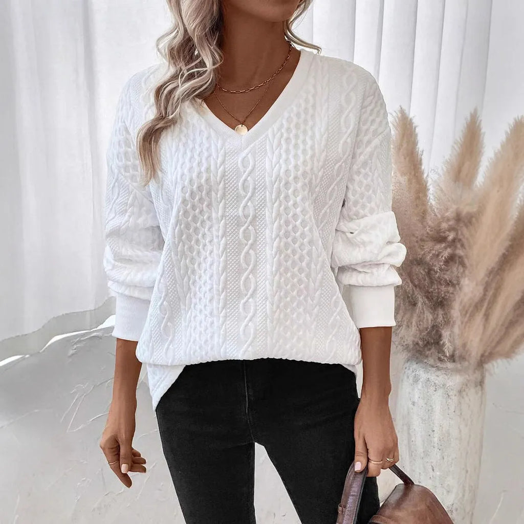 Milky white loose fit casual t-shirt with a raised 3D pattern on the front.