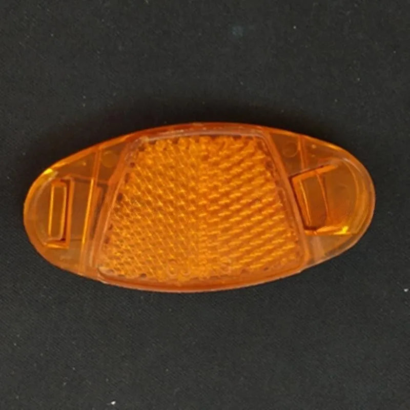 Bicycle plastic spoke reflector in white or yellow measuring 7.2cm length by 3.5cm width