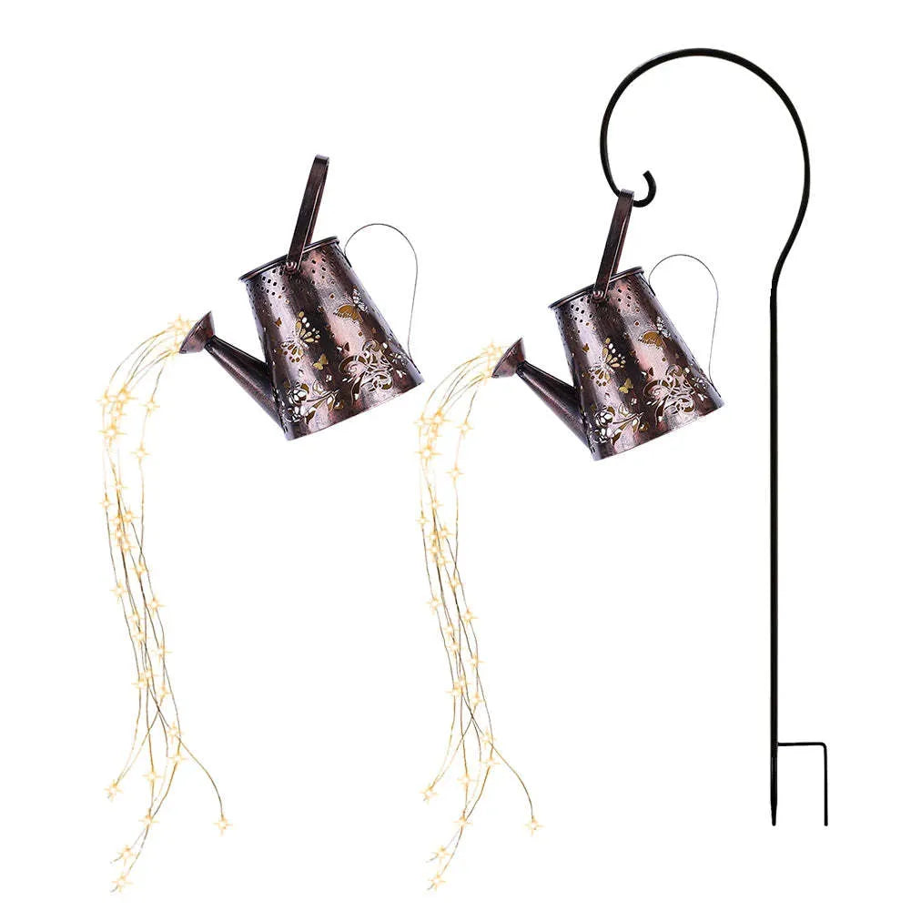 Solar-powered iron butterfly garden lamp with tapered silhouette and warm white LED light
