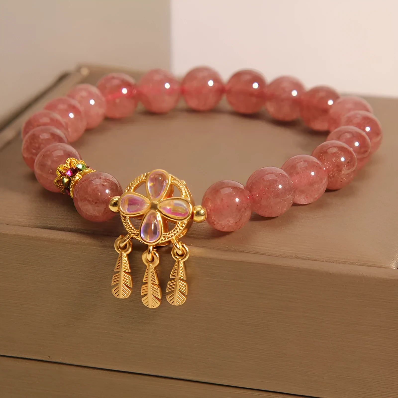 Natural strawberry quartz bracelet with four leaf clover dream catcher pendant on adjustable cord