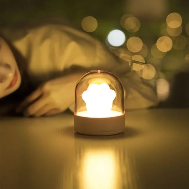 Grey and pink cat paw shaped USB rechargeable night light with musical functions