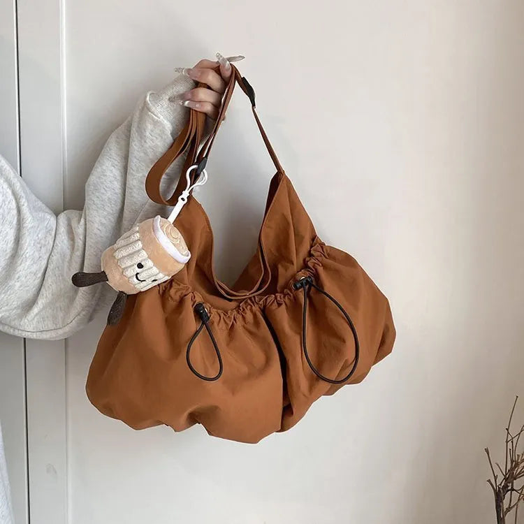 Ultra-light pleated crossbody student bag in polyester with folding design and internal phone pocket