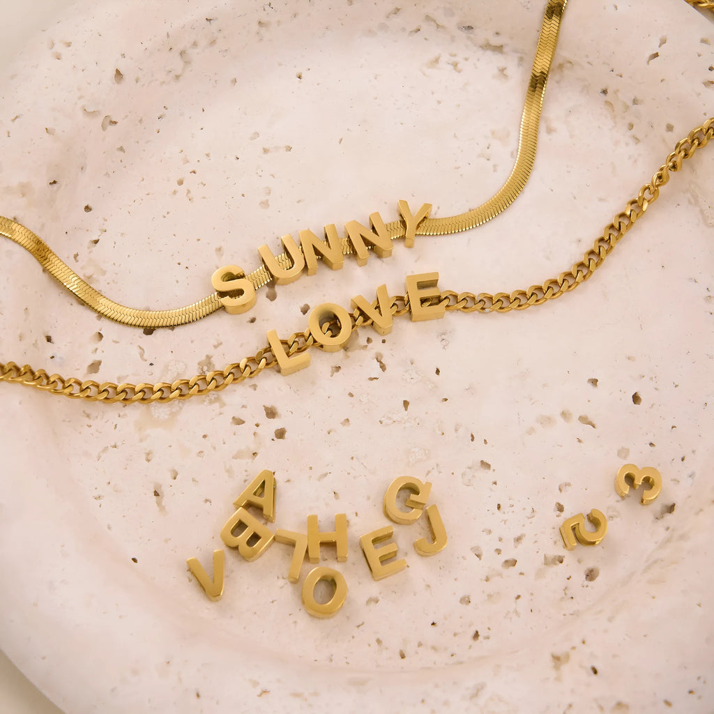 Titanium steel letter necklace with 40.5cm chain in gold electroplated finish showing number pendant