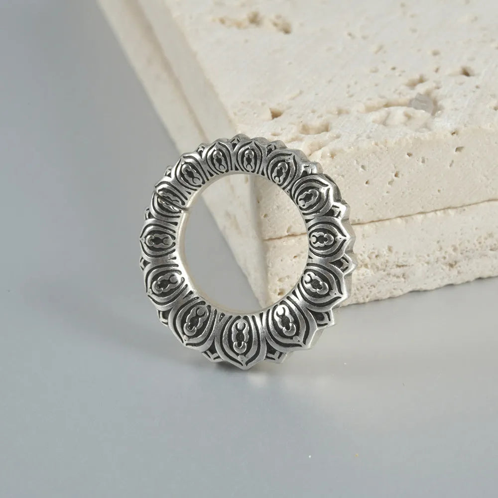 Retro stainless steel magnetic earrings in hollow heart and lotus shapes with antique silver and gold finishes.