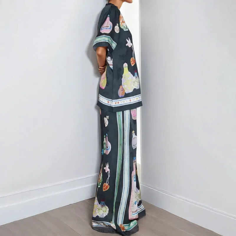 Women's black cartoon pattern holiday fashion set with trousers and cardigan-style top