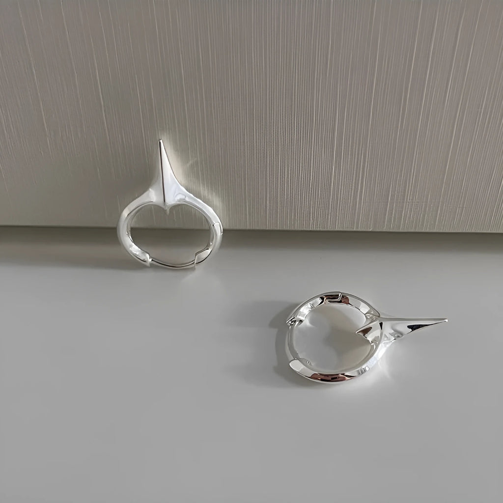 Geometric star-shaped ear clips with electroplated platinum finish on copper construction