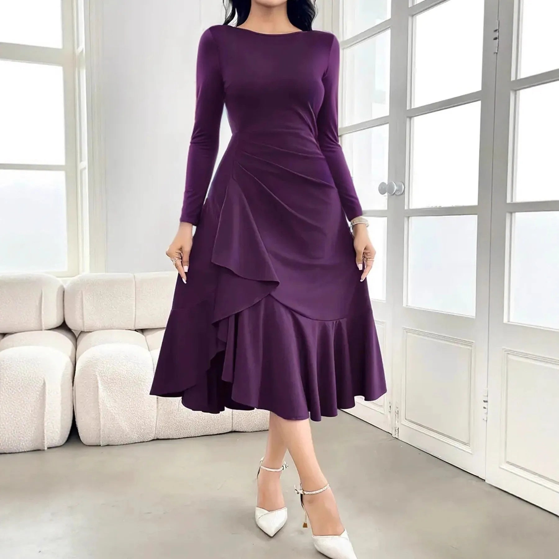 Purple women's long sleeve dress with ruffles and a round neck, shown on a mid-waist silhouette.