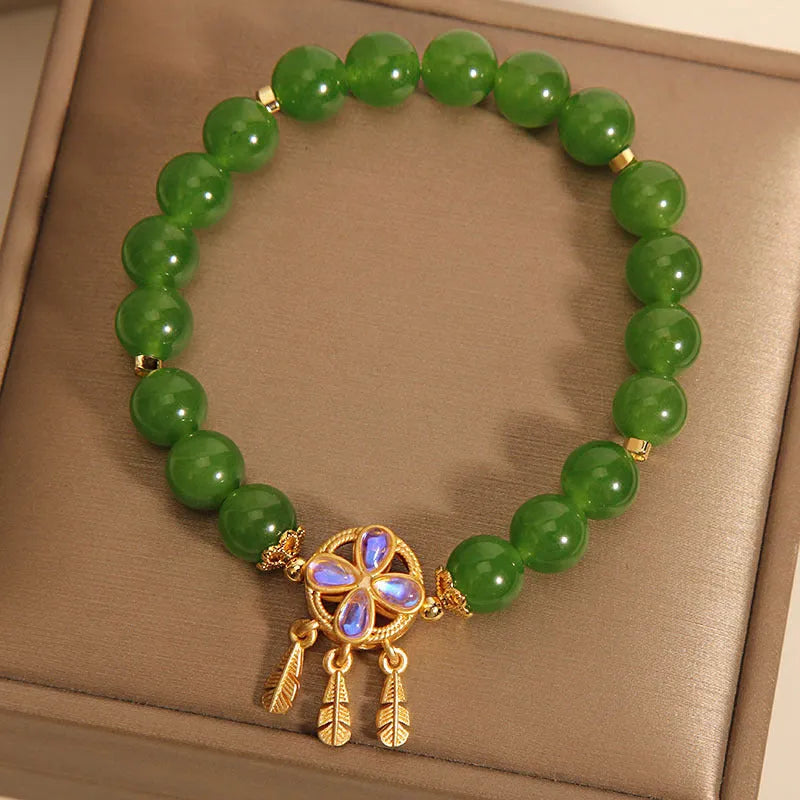 Green jasper crystal bracelet for women with four-leaf clover dream catcher pendant.