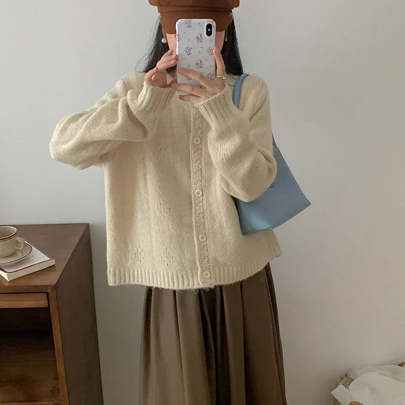 Art retro style loose-fit sweater coat in viscose fibre, shown in apricot colour.