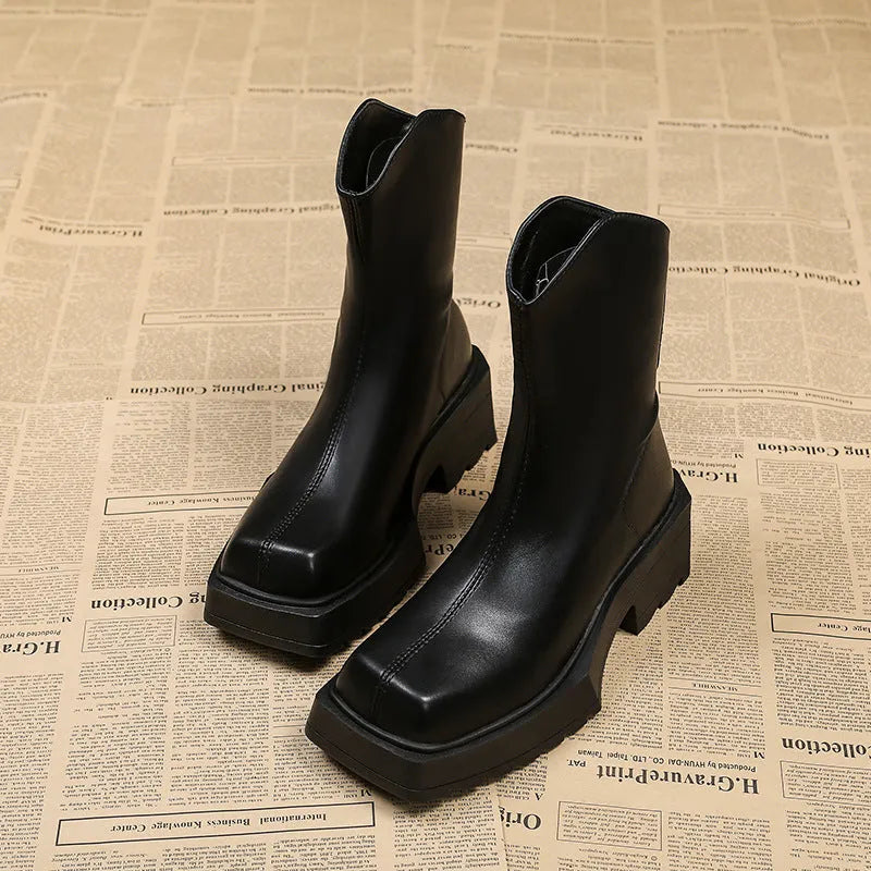 Black platform Martin boots for women with square toe and back zipper, shown on a white background.