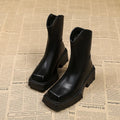 Black platform Martin boots for women with square toe and back zipper, shown on a white background.