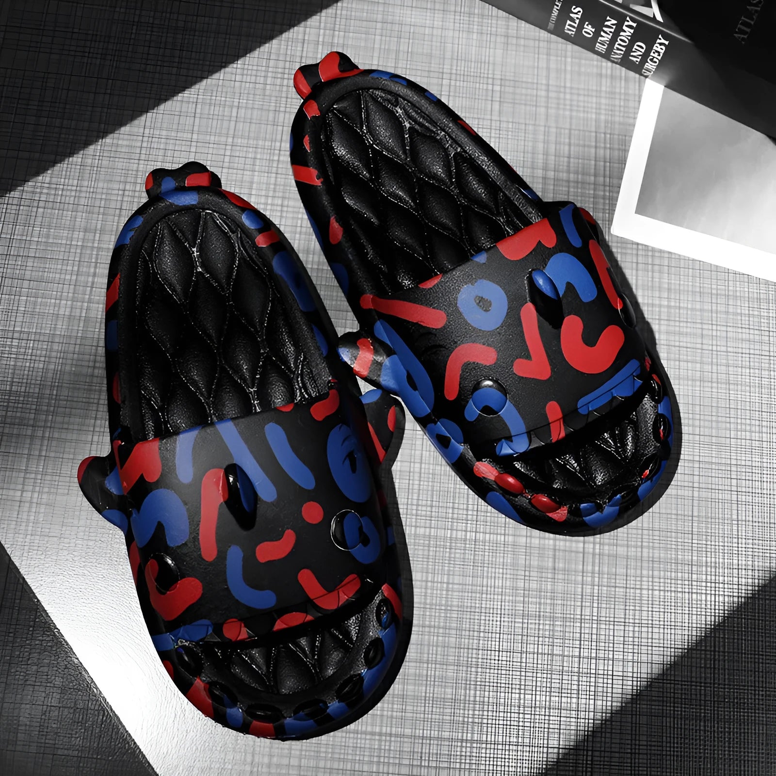 EVA open-toe shark-themed couple slippers in assorted colours on a white background.