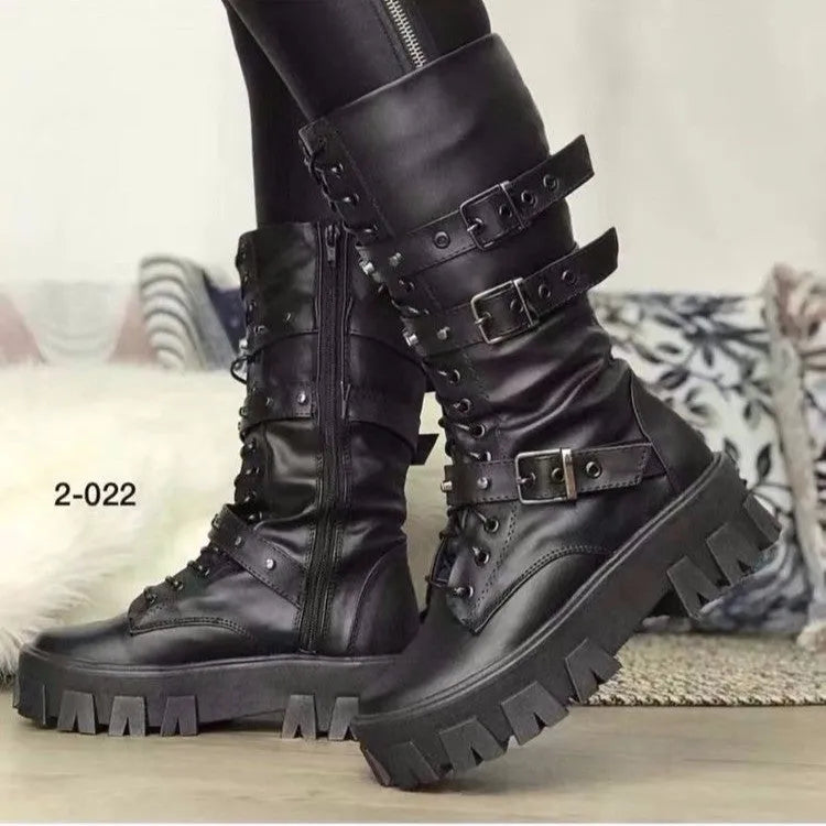 Women's black mid-calf boots with side zip and metal buckle detail on a white background.