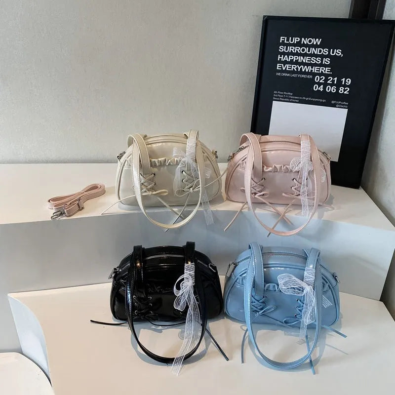 Women's fashion handbag with bandage bow design and mobile phone compartment in selected colour