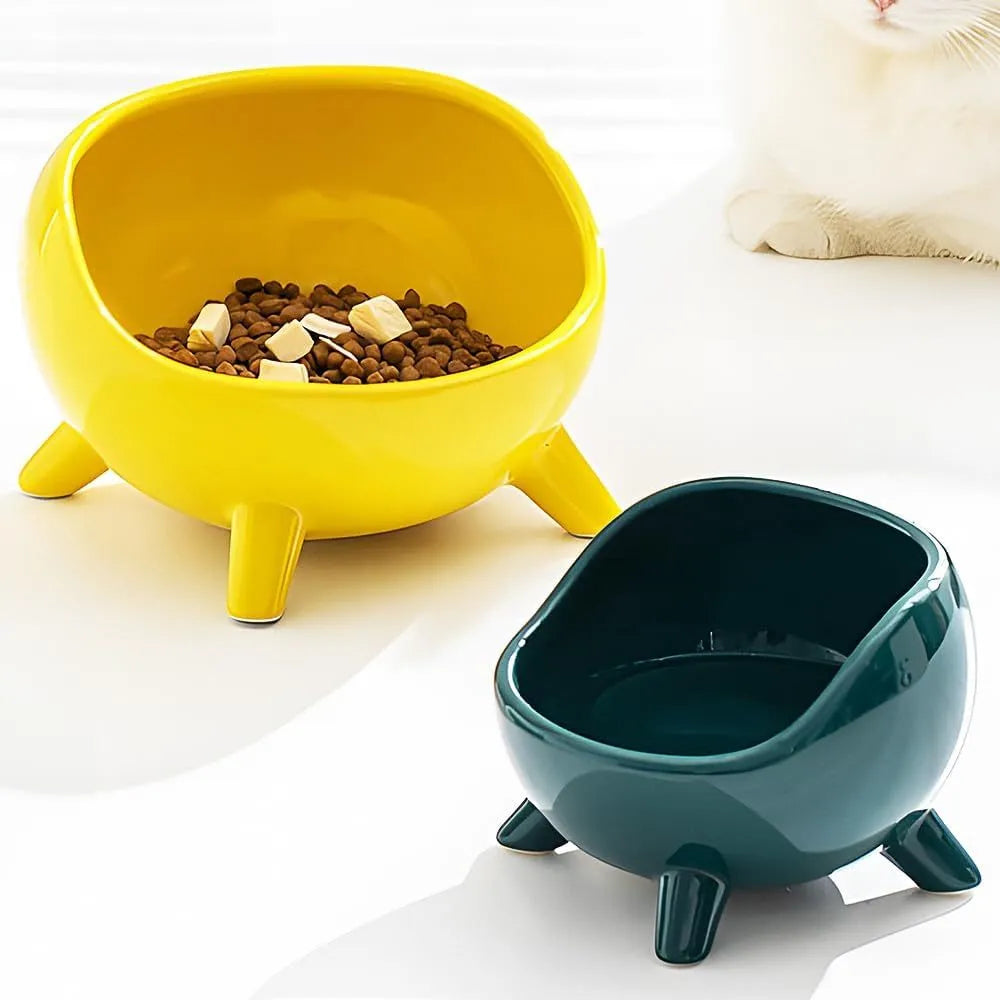 Green ceramic cat food bowl with four-legged stability base and wide mouth opening