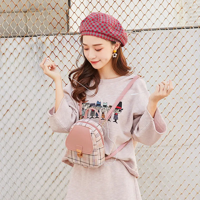 Diagonal shoulder phone bag in PU leather shown in one of five colours: black, blue, brown, pink, or red.