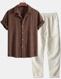 Camouflage printed short-sleeve shirt and trousers casual suit set on a hanger.