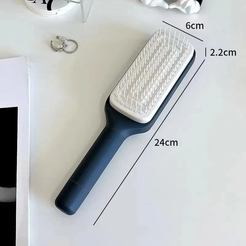 Roland purple self-cleaning hair brush with rotating handle and anti-static massage bristles.