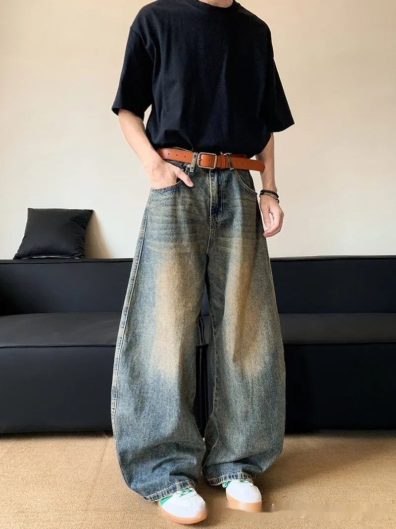 Men's retro blue distressed jeans with machete wash pattern and wide-leg design