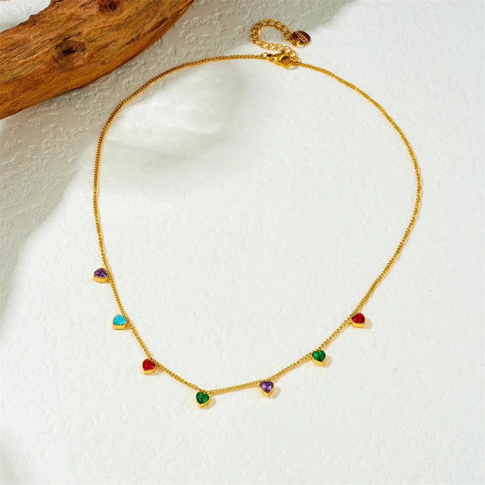 Gold-coloured heart pendant on a stainless steel chain necklace for women.