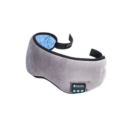 Black Bluetooth sleep eye mask with small integrated wireless earphones, shown in a relaxed position on a pillow.
