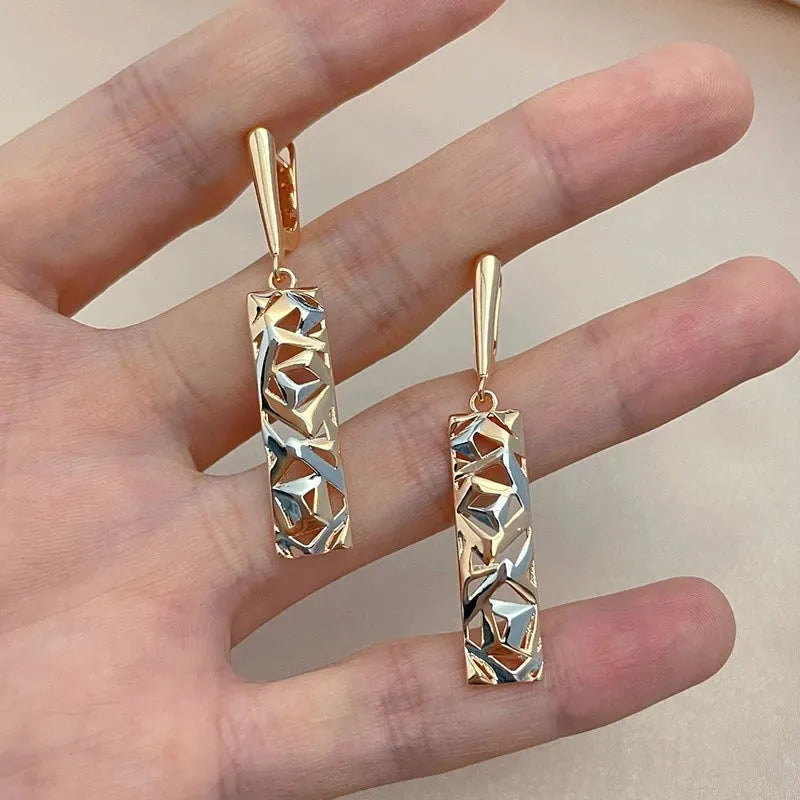 Rectangular two-tone hollow stud earrings with geometric design and silver electroplated finish