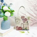 Double-sided gold wire embroidered canvas tote bag showing front and back design, available in multiple sizes and colours.