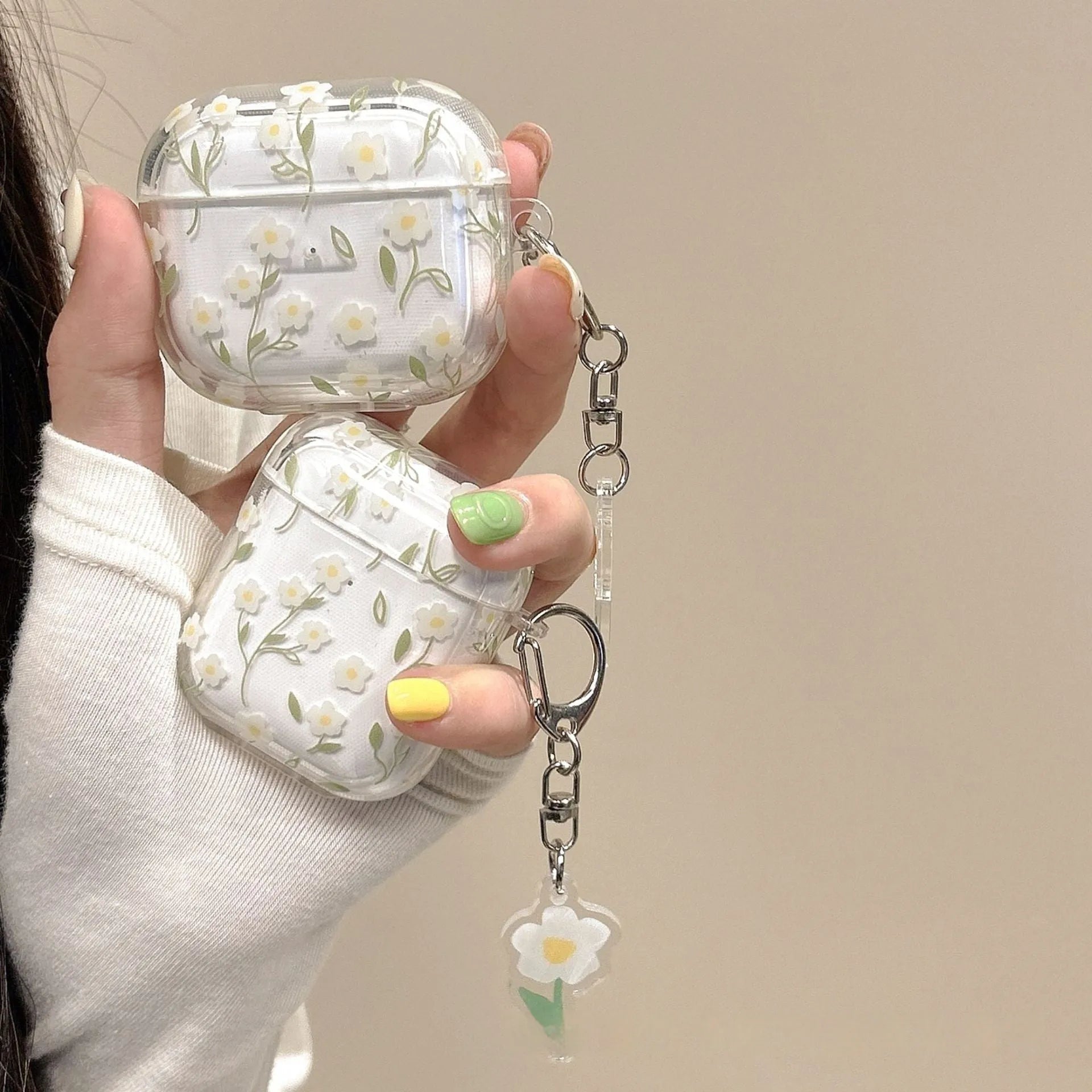 Transparent TPU AirPods case cover with white floral design showing compatibility with multiple Apple AirPods models