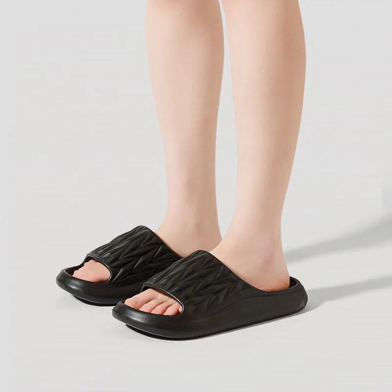 Leaf texture design EVA household slippers in multiple colours on a white background.