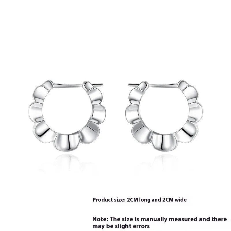Sterling silver geometric earrings with circular elements and retro design