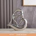 Modern white porcelain love heart ornament with geometric style on a table.
