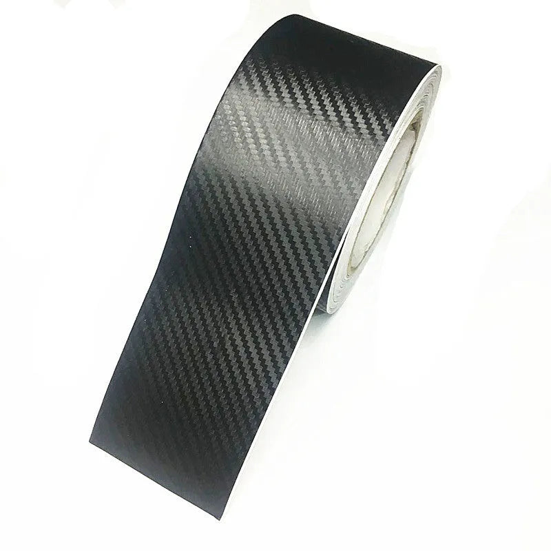 Matte black 3D carbon fibre roll for car door sill and bumper protection, showing texture and width options.