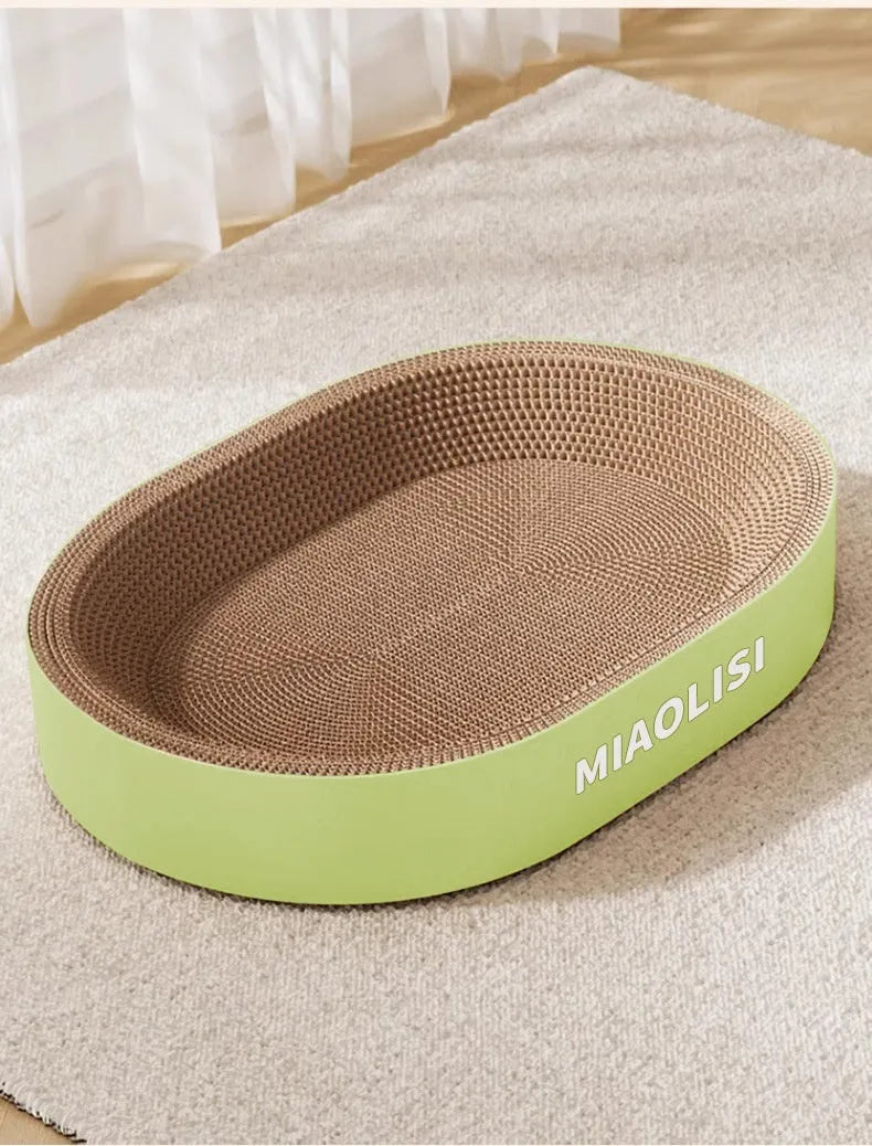 Green oval cat scratch board with integrated nest measuring 55cm in diameter