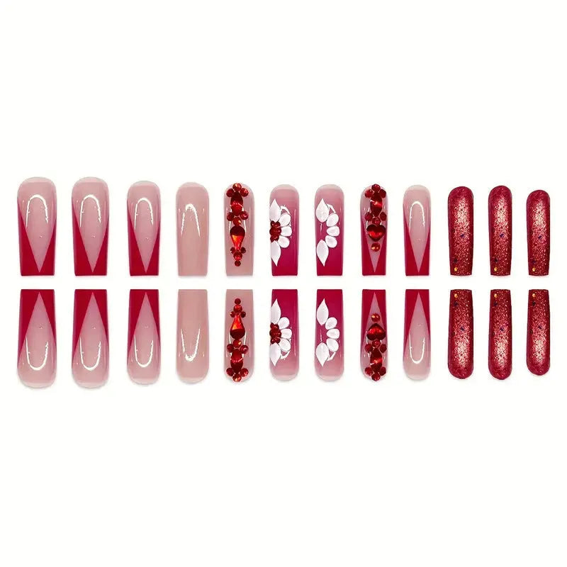 Long European square fake nails with red diamond and flower pattern design, shown with glue and file