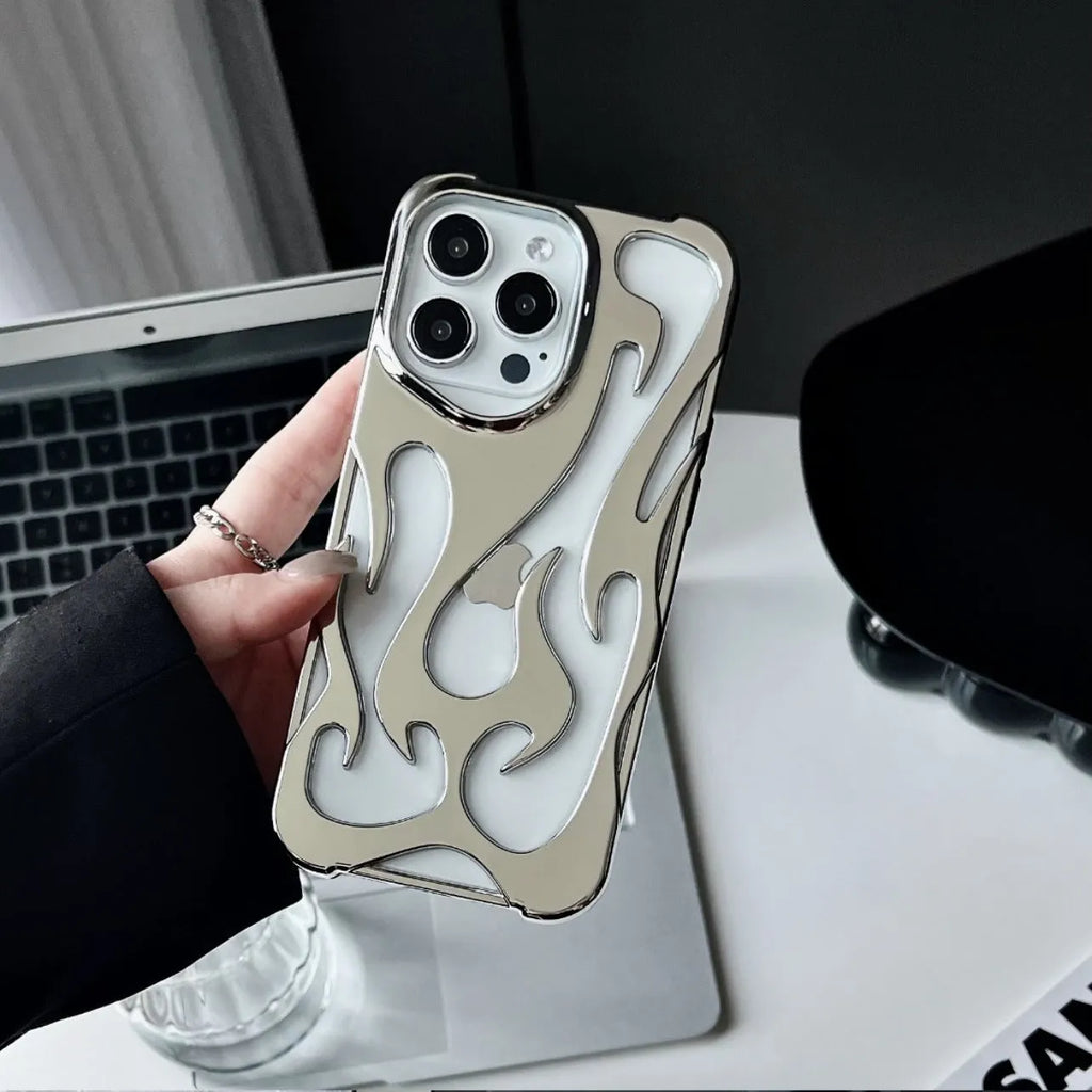 Apple iPhone case with hollow flame pattern and electroplated finish in silver, shown on a phone.