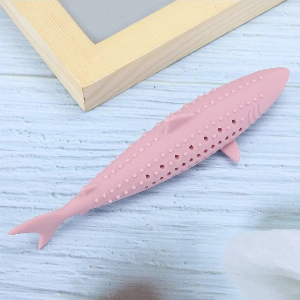 Green silicone fish-shaped cat chew toy with removable parts for catnip, shown on a white background.