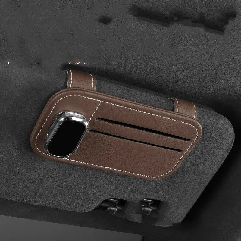 Cowhide leather car sun visor holder with card slots and integrated sunglasses clip.