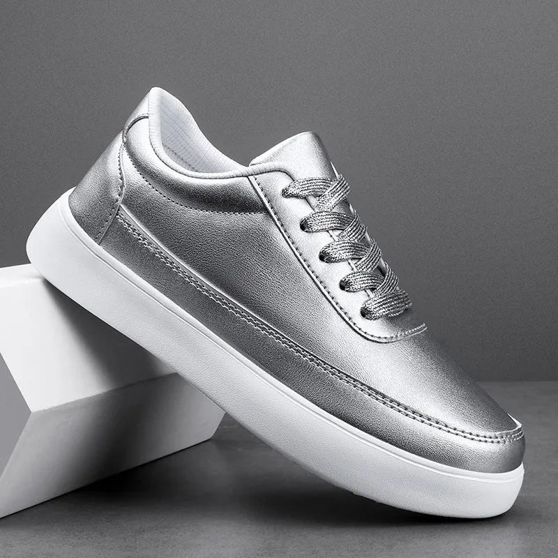 Women's white leather lace-up flat casual shoes on a plain background.