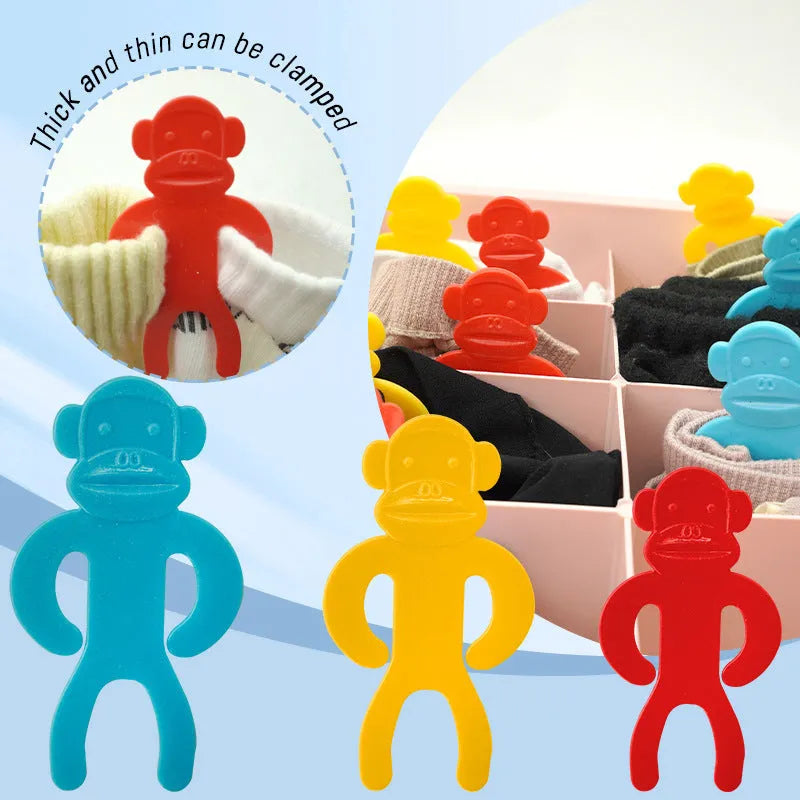Plastic sock clips in blue, yellow and red colours for machine washing organisation