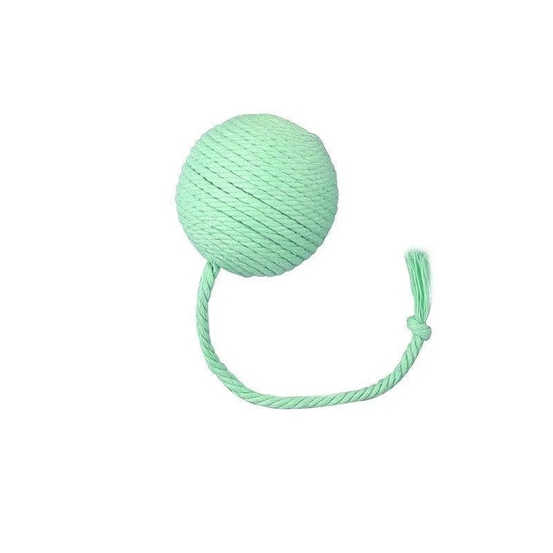Green cat toy ball with a rope handle looped through it, shown next to a smaller pink version.