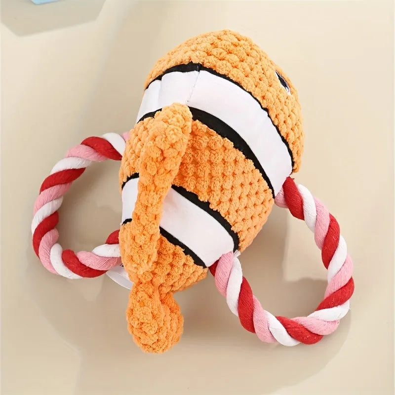 Grey, green, and orange turtle-shaped dog plush toy with a visible textured rope knot centre.