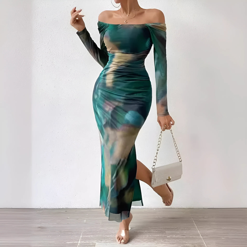 Woman wearing a printed gradient colour mesh fishtail dress with pleats and a square collar