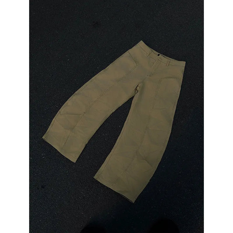 Men's straight leg khaki cotton trousers on a hanger, showing classic casual style.