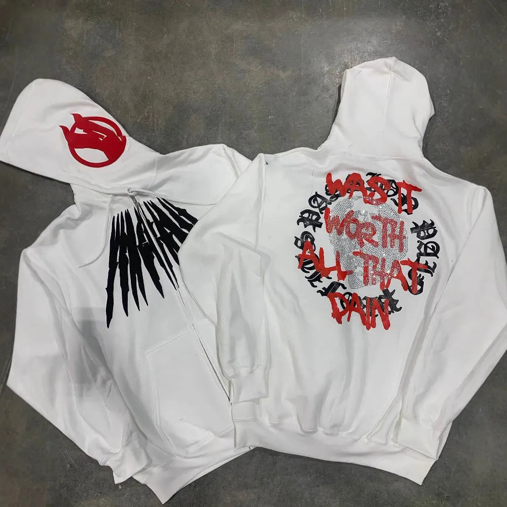 Black loose hooded sweatshirt with white printed skull and rhinestone design, showing cardigan style and long sleeves.