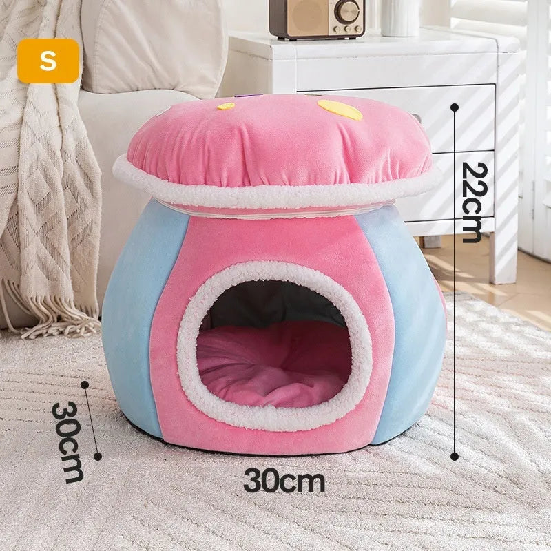 Grey mushroom-shaped plush cat bed on a wooden floor.
