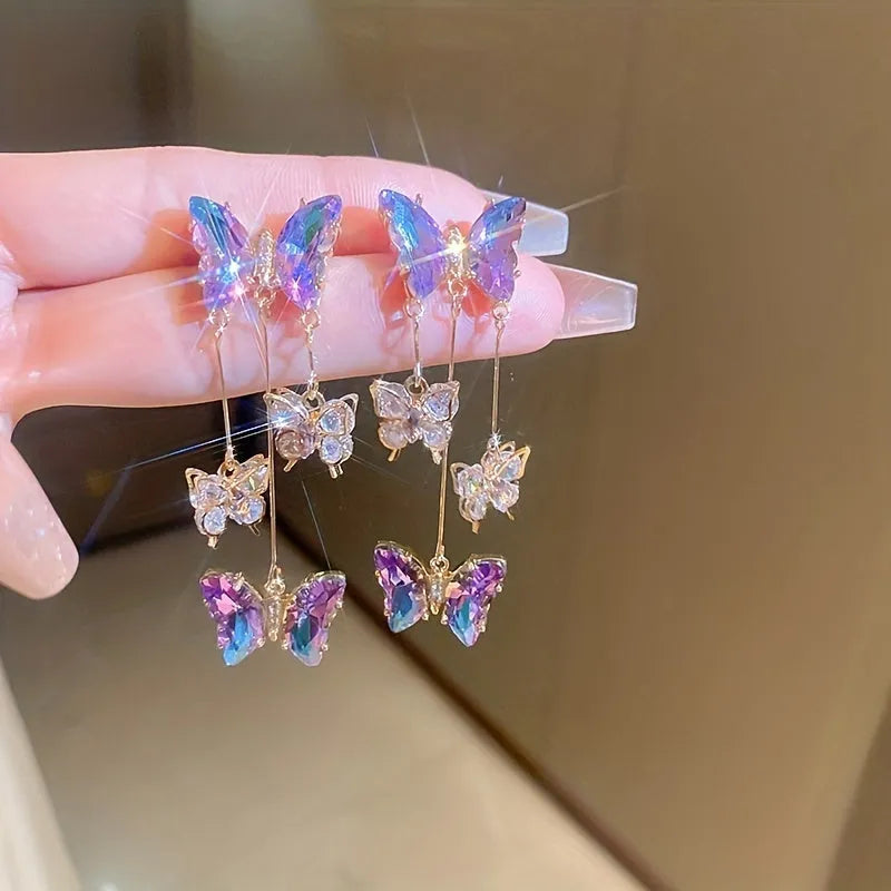 Blue purple alloy drop earrings with crystal flowers, butterfly design and tassel detailing