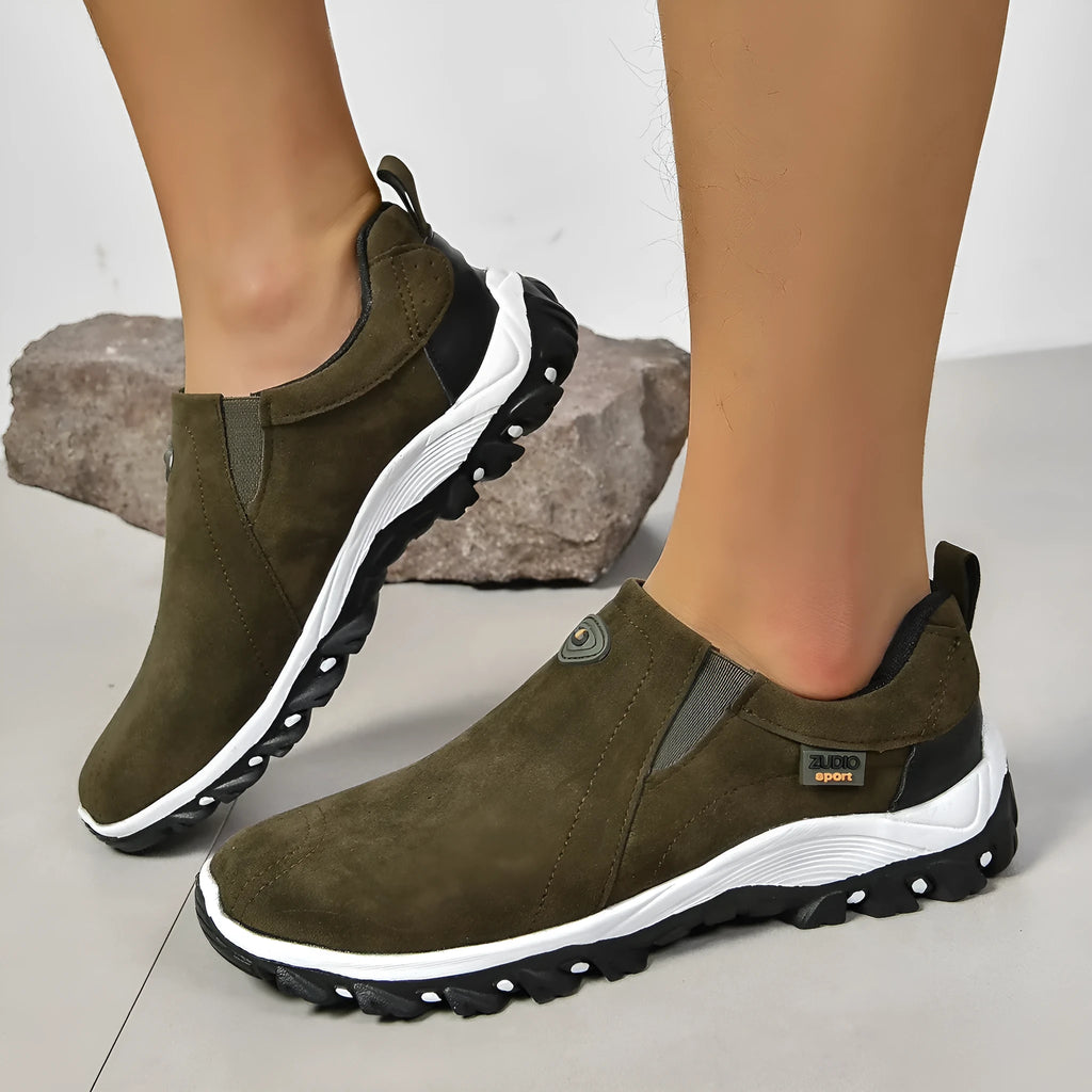 Men's thin grey overshoe cover with round toe and rubber sole, shown on a shoe.